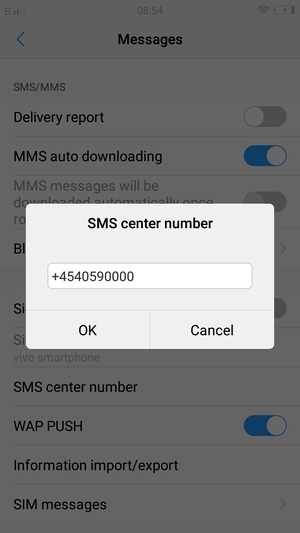 Enter the SMS center number and select OK