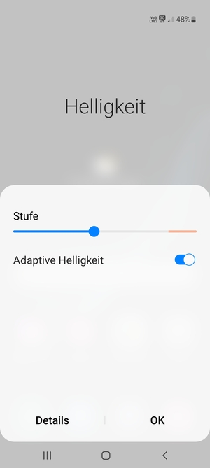 Schalten Sie Adaptive Helligkeit ein und wählen Sie OK